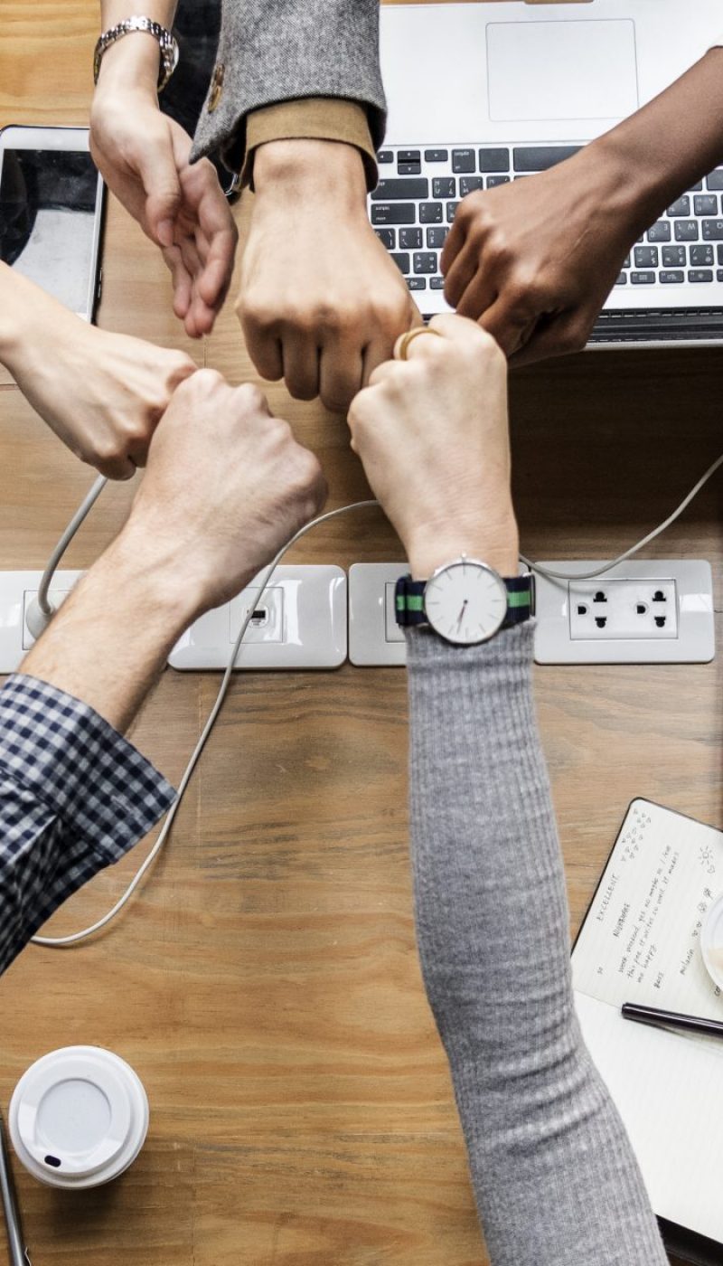Colleagues giving a fist bump Colleagues giving a fist bump